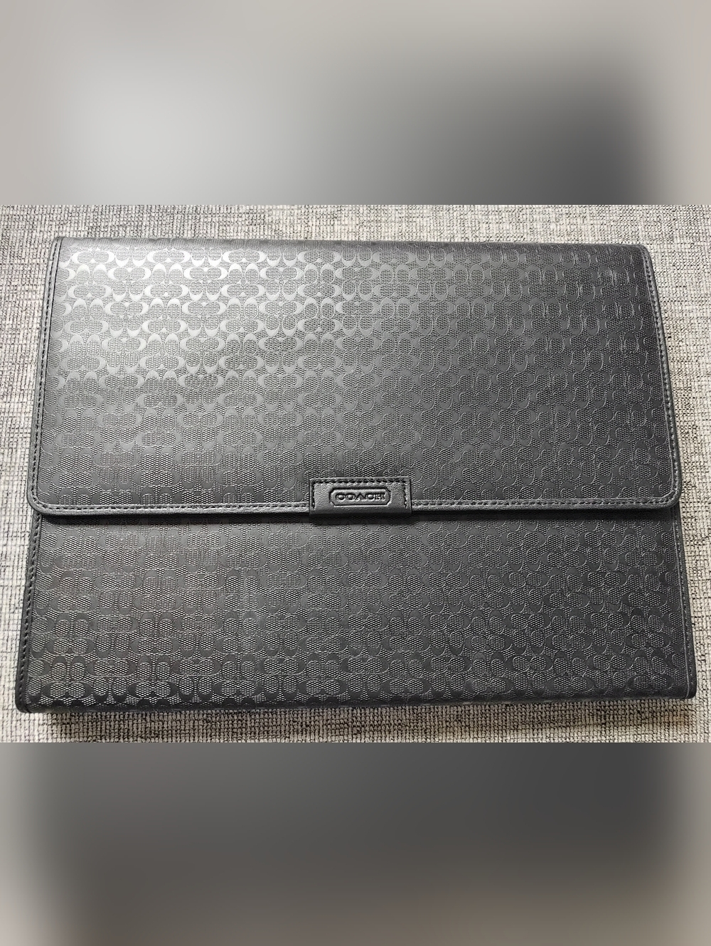 This item is a Coach Heritage Signature Embossed Trifold Portfolio Mobile Office